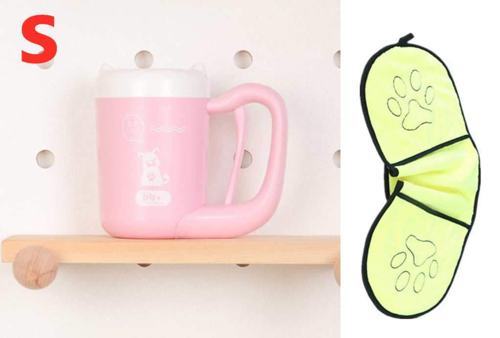 Pink mug on a wooden shelf with a green butterfly-shaped item next to it.