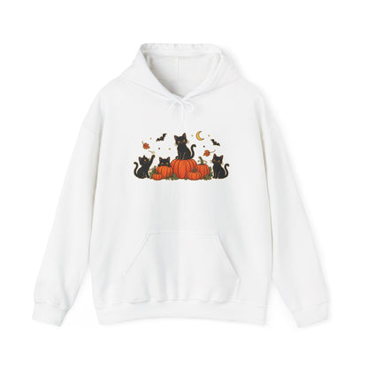 A white pullover hoodie with a front graphic of black cats sitting on orange pumpkins, surrounded by small bats, leaves, and a crescent moon, shown on a plain white background.