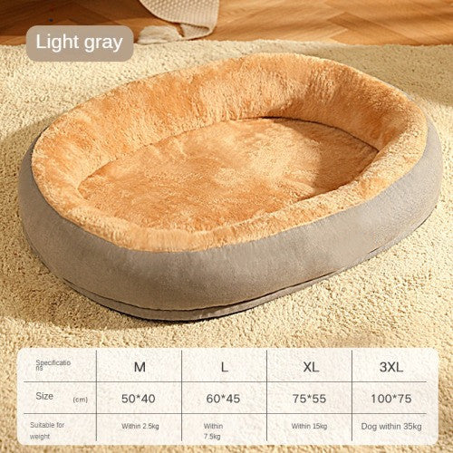 Round pet bed with light gray exterior and beige interior on a carpeted floor.