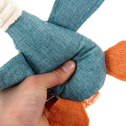 Hand holding a textured blue and orange toy with 'my first' branding.