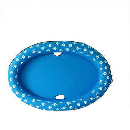 Blue pet pad with white paw prints on a white background