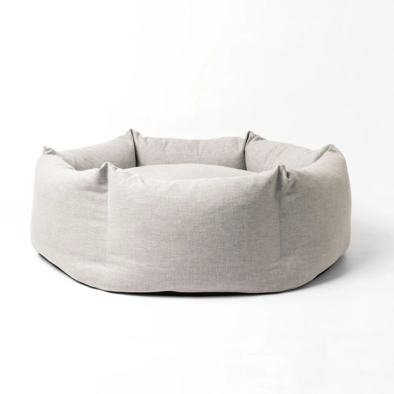 Light gray pet bed on a white background