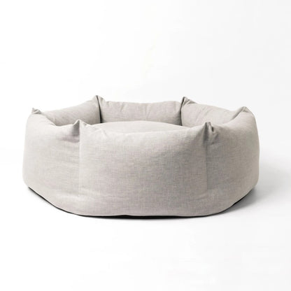 Light gray pet bed on a white background