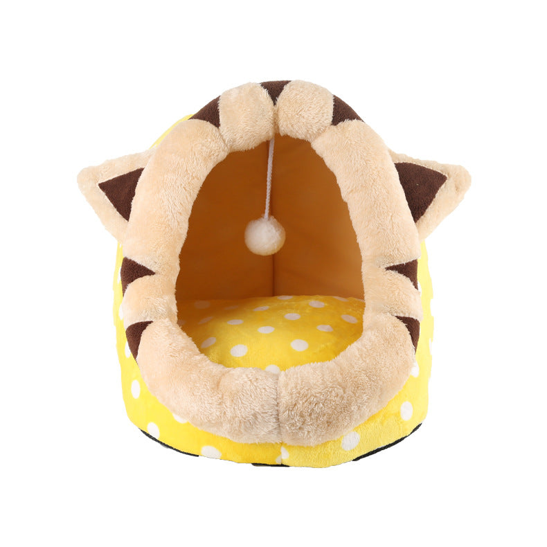 Pet bed designed like a lion with yellow polka dot interior on a white background