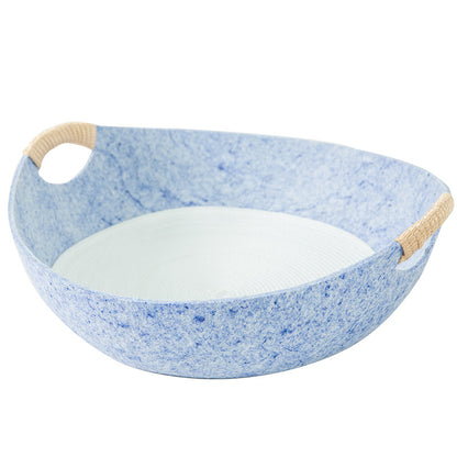 Blue speckled bowl with beige handles on a white background