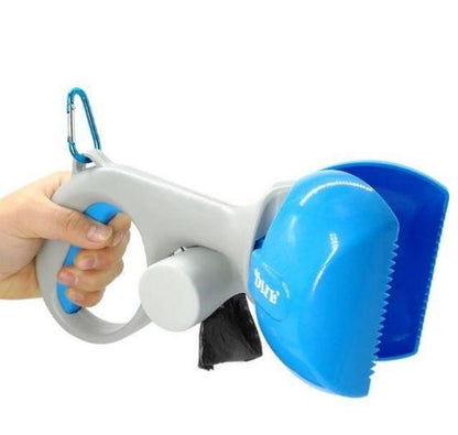 Pet grooming tool with blue and gray design, held by a hand on a white background.