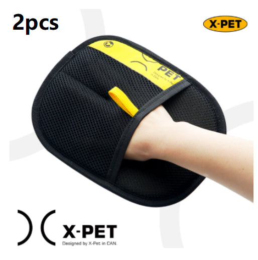 Black pet grooming mitt with yellow label held by a hand, branded 'X-Pet'.