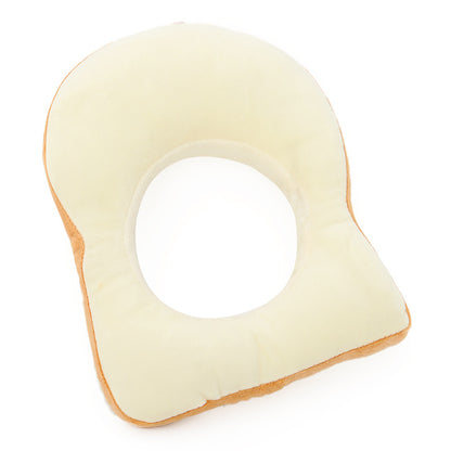 White bread-shaped pillow on a white background