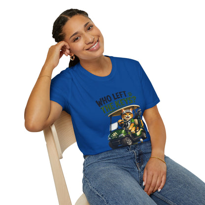 A woman wearing a royal blue graphic t-shirt with a cartoon cat in a golf cart and the text 'WHO LEFT THE KEYS?' sitting on a light wood chair against a white background.