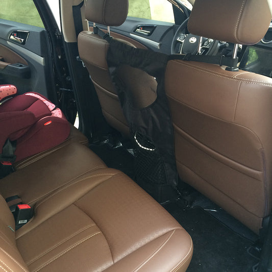 Brown car interior with a red child seat in the back