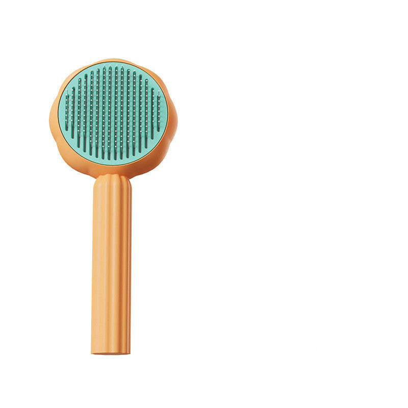 Pet grooming brush with green bristle head and wooden handle on a white background
