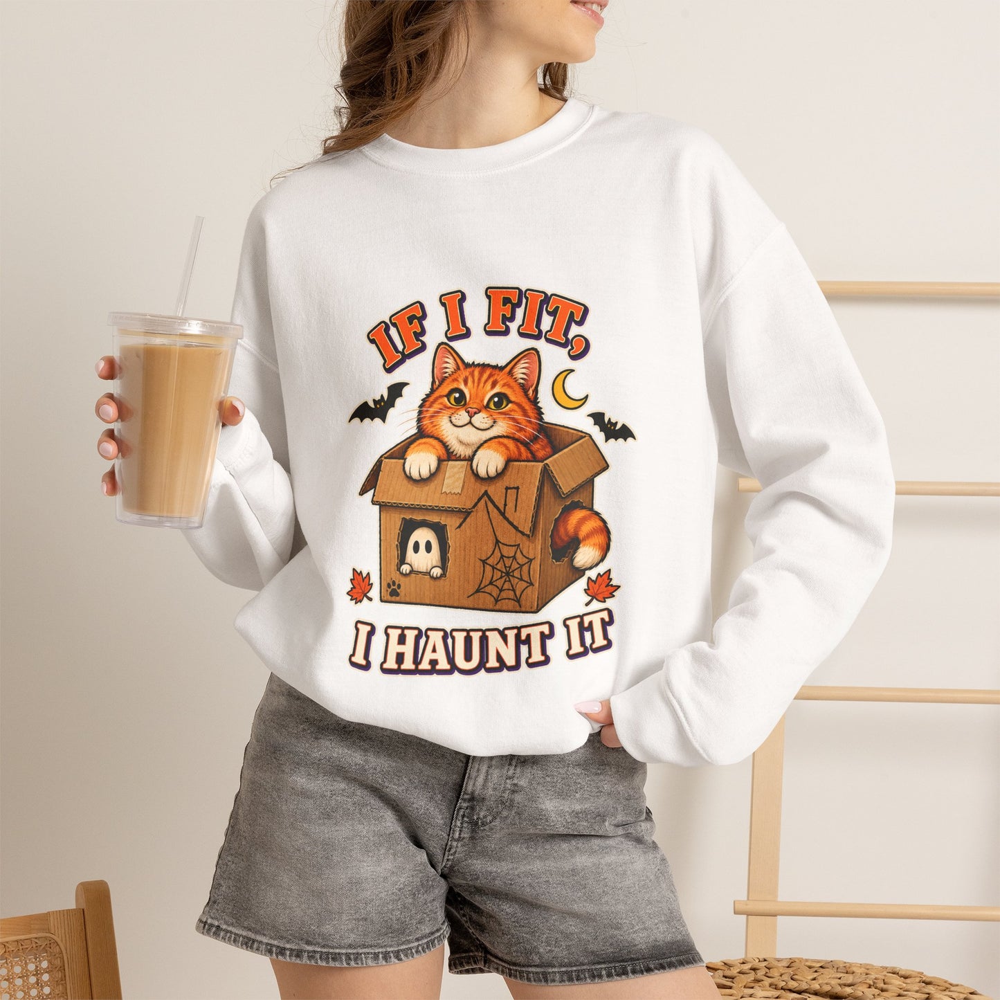 If I Fit I Haunt It Halloween cat sweatshirt in white
Orange tabby in haunted cardboard box on Halloween sweatshirt