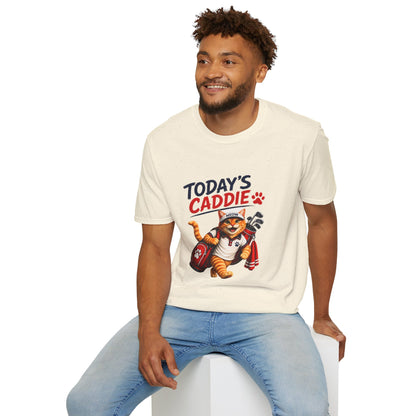 An natural short-sleeve crewneck t-shirt featuring a cartoon graphic of an orange tabby cat wearing a cap and holding golf clubs, with the text 'TODAY'S CADDIE' 
