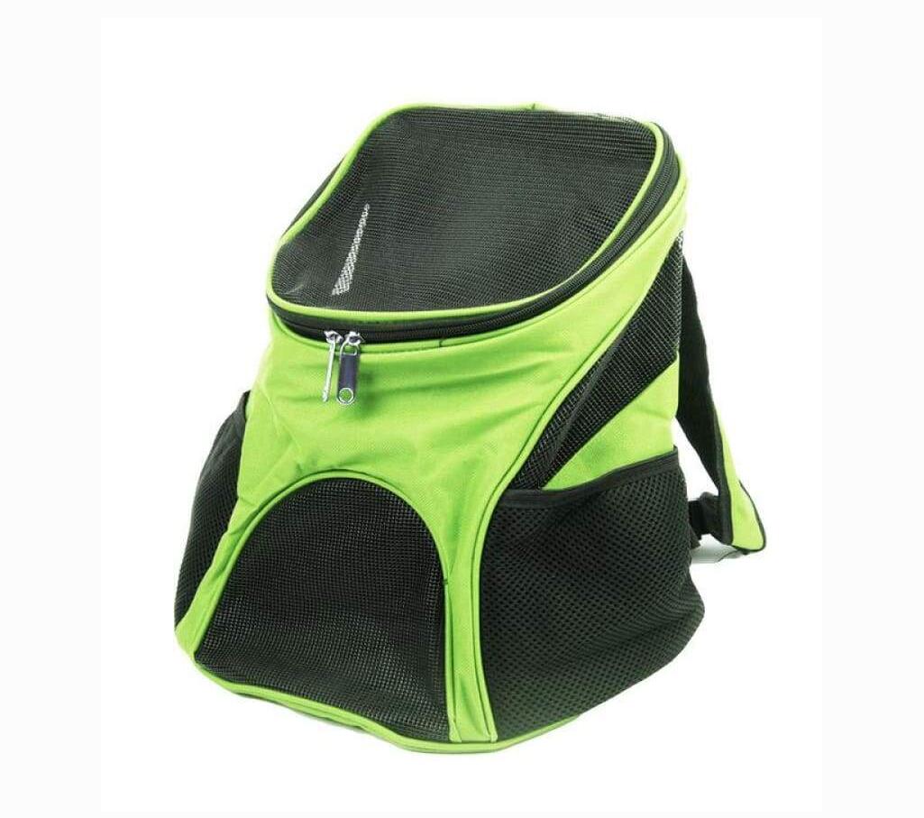 Green and black pet carrier backpack on a white background