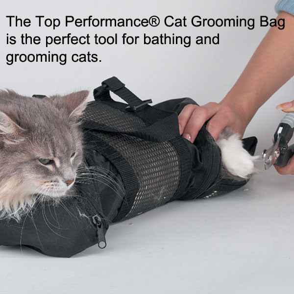 Cat being bathed and groomed using a Top Performance cat grooming bag.
