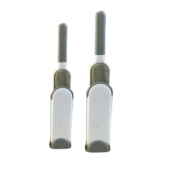 Two white and gray pet grooming brushes on a white background