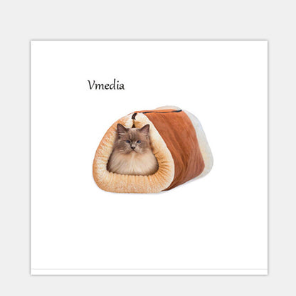 Cat lying in a brown and white pet cave on a white background with 'Vmedia' branding.
