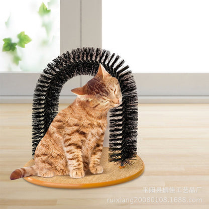 Cat using a self-grooming arch toy on a wooden surface.