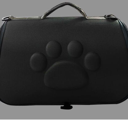Black pet carrier with a paw print design on a gray background