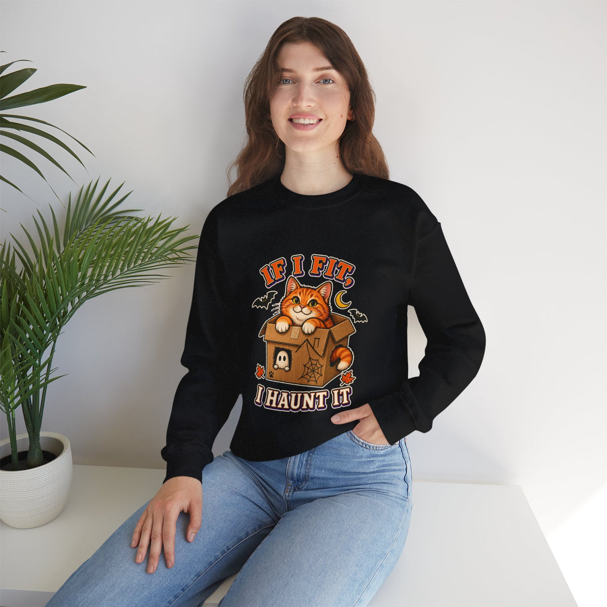 If I Fit I Haunt It Halloween cat sweatshirt in black
Orange tabby in haunted cardboard box on Halloween sweatshirt