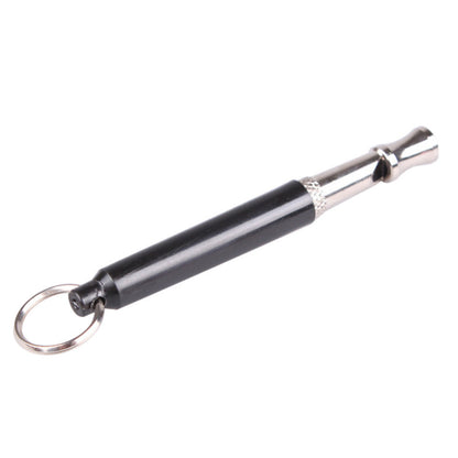 Black and silver dog whistle on a white background