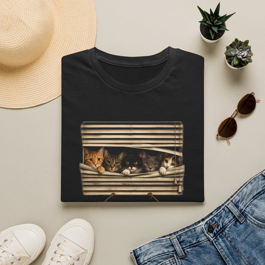 A black folded short-sleeve crewneck t-shirt featuring a graphic print of three cats sleeping in a window with a hanging sign that reads 'The Neighborhood Watch'.