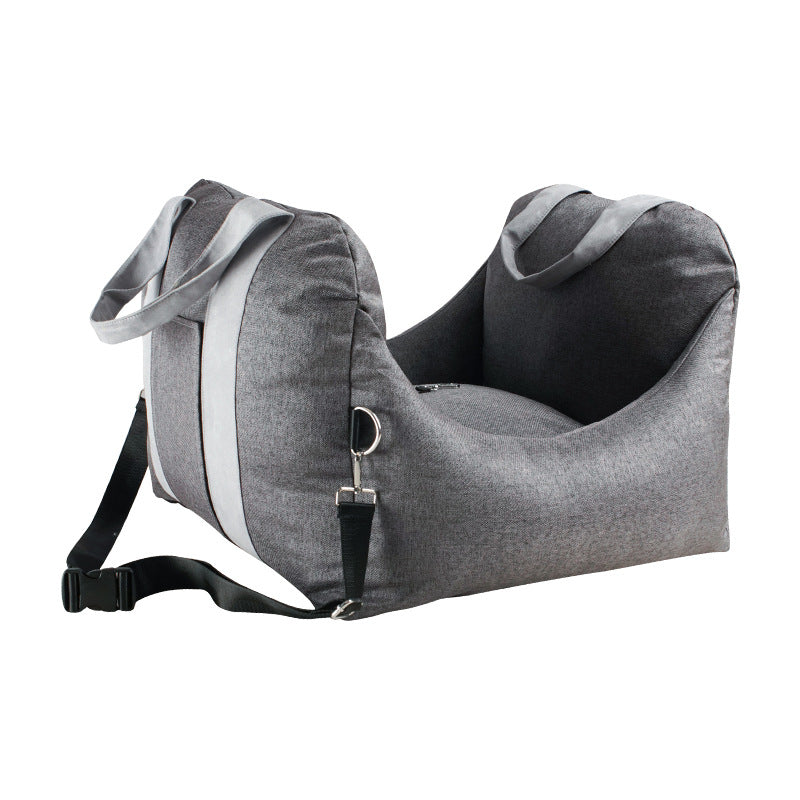 Gray pet car seat with straps on a white background