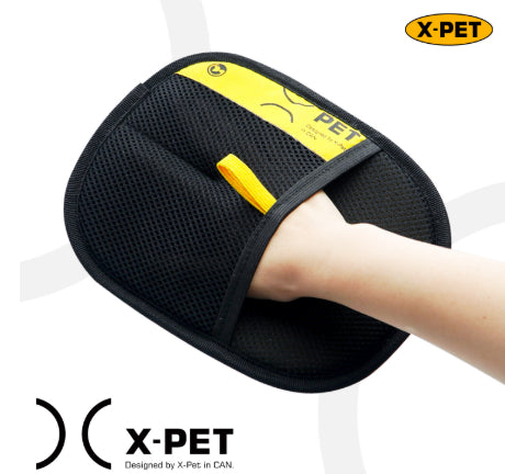 Black and yellow pet product held by a hand with X-Pet branding.