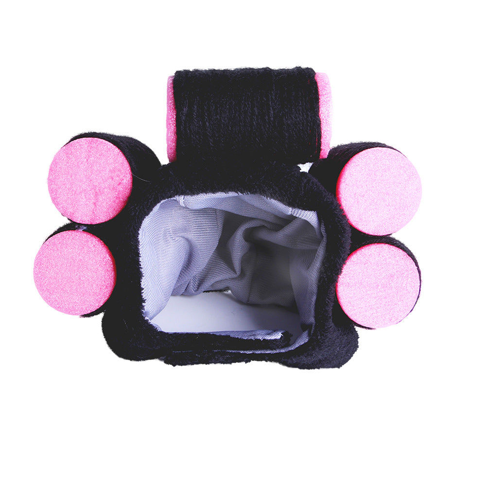 Black and pink paw-shaped product on a white background