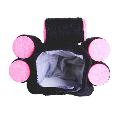 Black and pink paw-shaped product on a white background