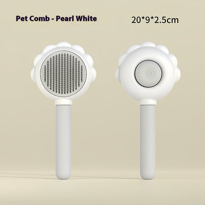 Pet comb with white handle and pearl white head on beige background
