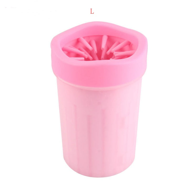 Pink silicone cup with bristle brush on a white background