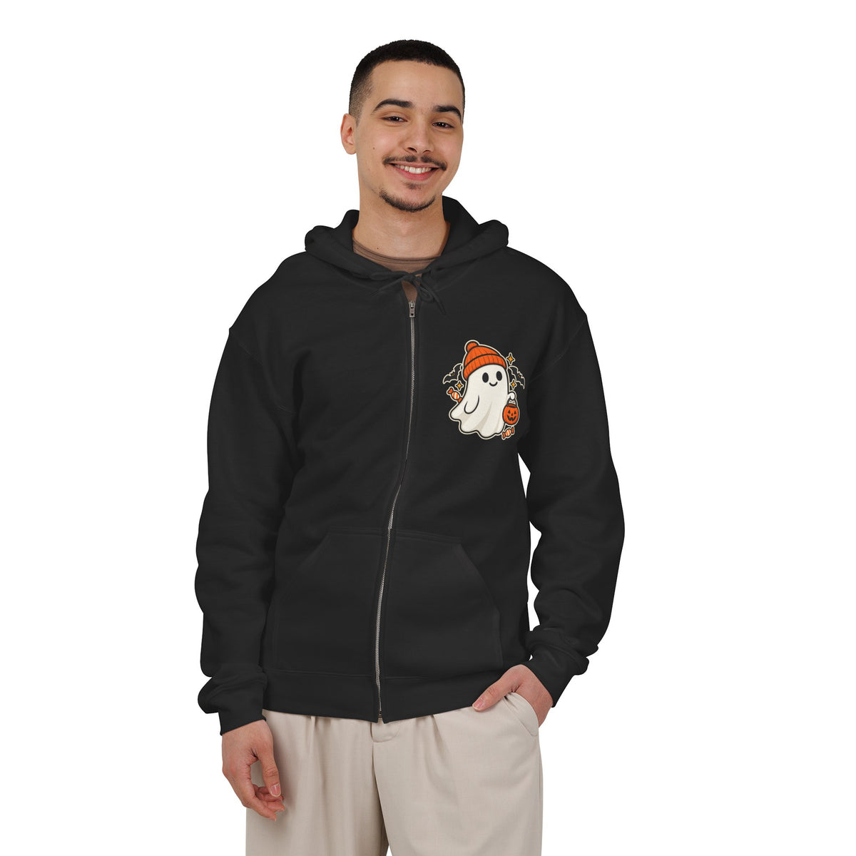 Black unisex Halloween zip-up hoodie with a trick-or-treat ghost design on the left chest