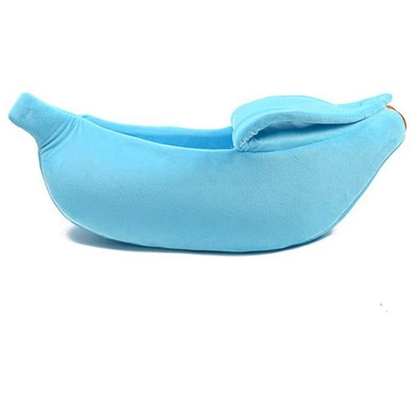 Light blue banana-shaped pet bed on a white background