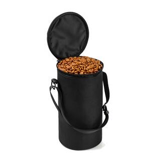 Black cylindrical bag with a handle filled with almonds on a white background