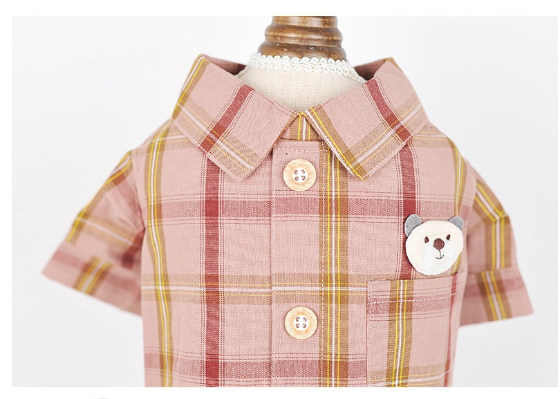 Plaid shirt with bear design and buttons on a mannequin against a white background
