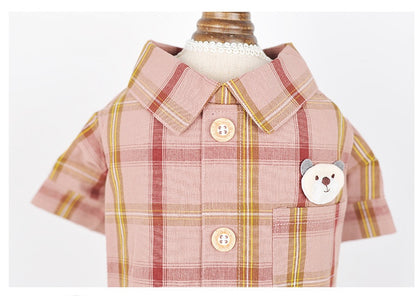 Plaid shirt with bear design and buttons on a mannequin against a white background