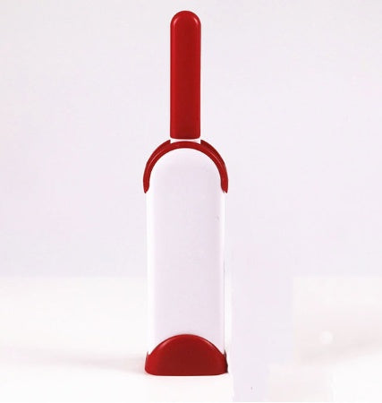 Red and white pet grooming tool on a white background