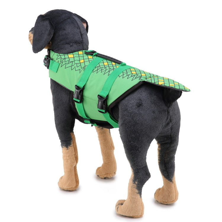 Dog wearing a green life jacket with a pattern on a white background