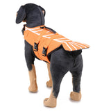 Dog wearing an orange life jacket with black accents on a white background