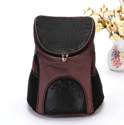 Brown pet carrier with black mesh on a white background