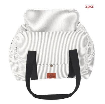 White striped bag with black straps on a white background