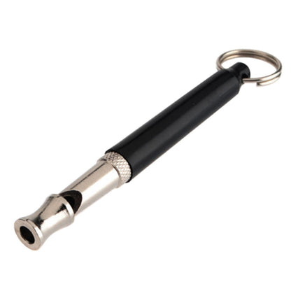 Black and silver dog whistle with keychain on a white background