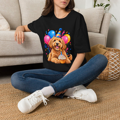 Woman sitting on floor wearing a Black Birthday Dog T-Shirt with colorful puppy birthday party design