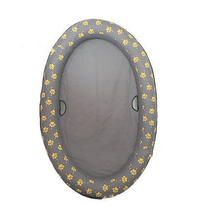 Gray pet bed with yellow paw prints on a white background