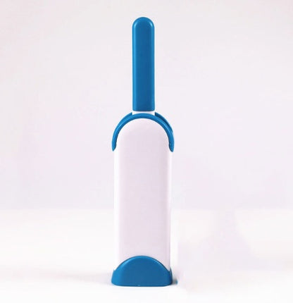 White and blue pet grooming brush on a white background
