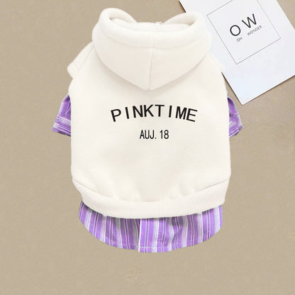 Pet outfit with white hoodie and purple plaid skirt on a beige background
