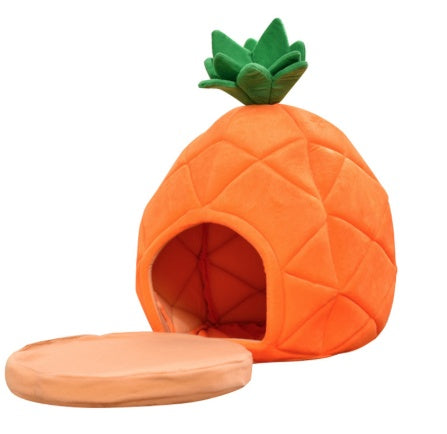 Pineapple-shaped pet bed with a green roof on a white background