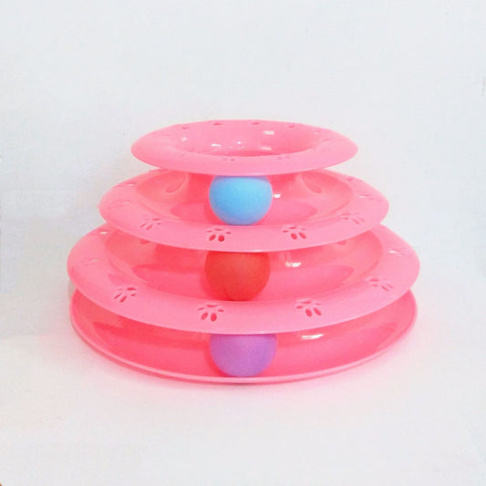 Pink tiered toy with colorful balls on a white background