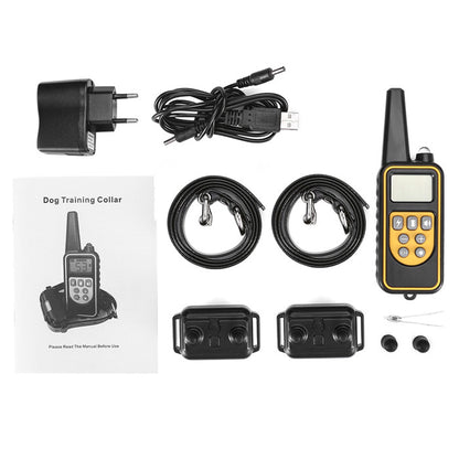 Dog training collar set with receiver, transmitter, charger, and cables on a white background